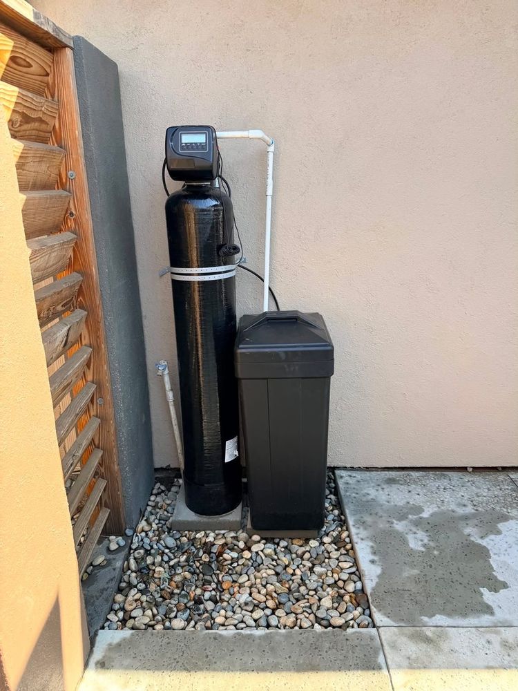 A water softener and brine tank Nick installed outside a Fresno home