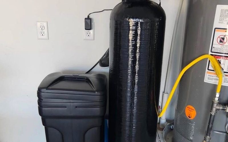 Whole-house water filtration and softener system installed in a Fresno garage